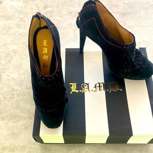 Black suede with red trim shoes